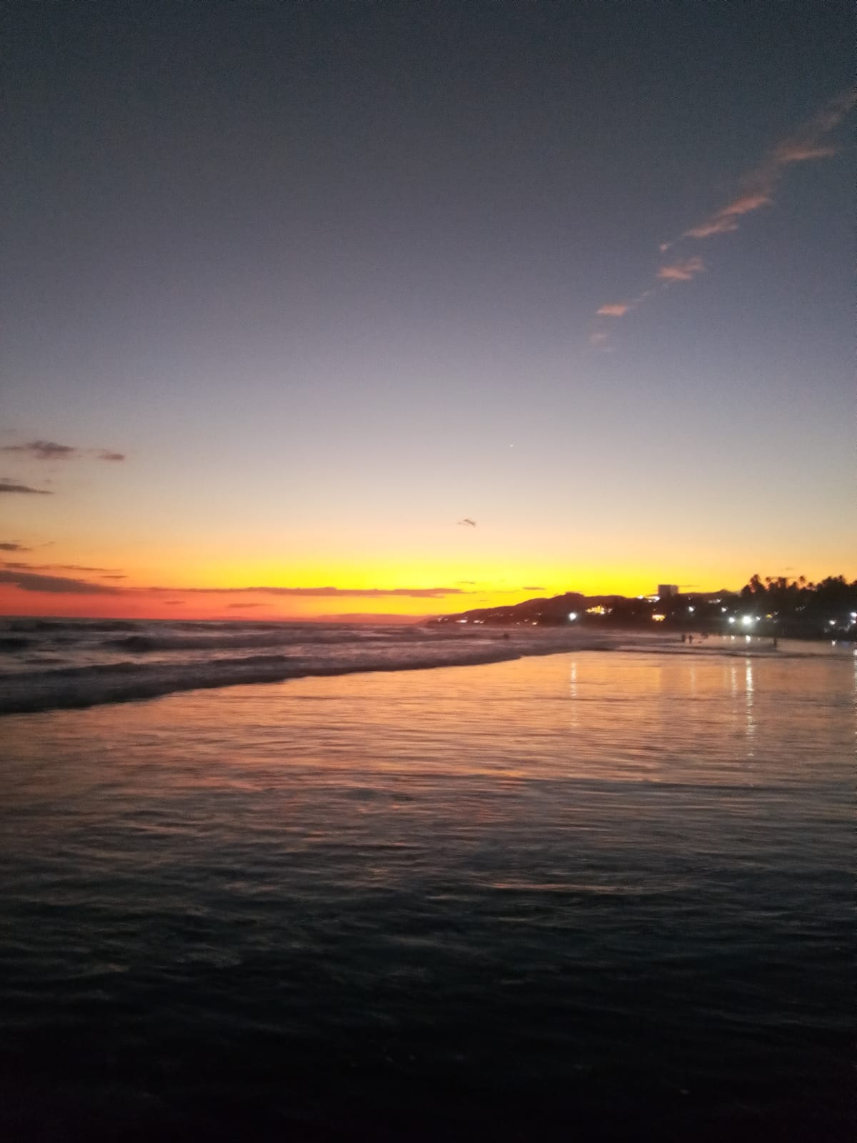 Golden Pacific sunset reflecting on the shore of El Salvador